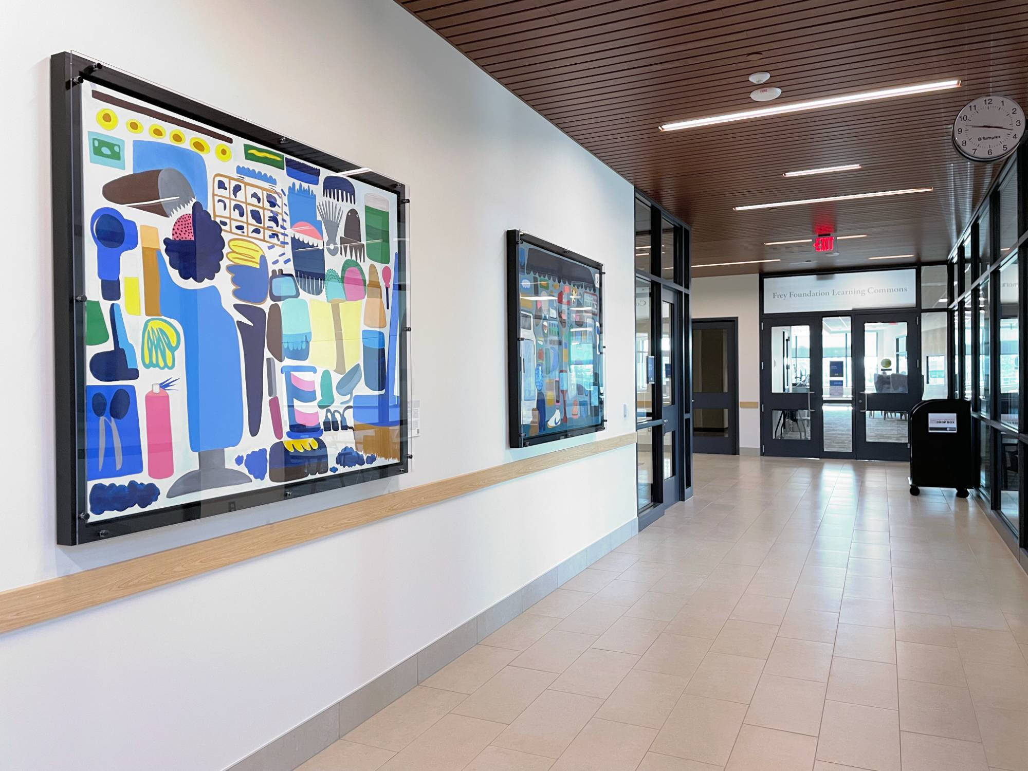 Color photograph of two paintings by Rosie Lee installed in DCIH.